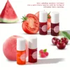 Lip gloss alongside fresh fruit